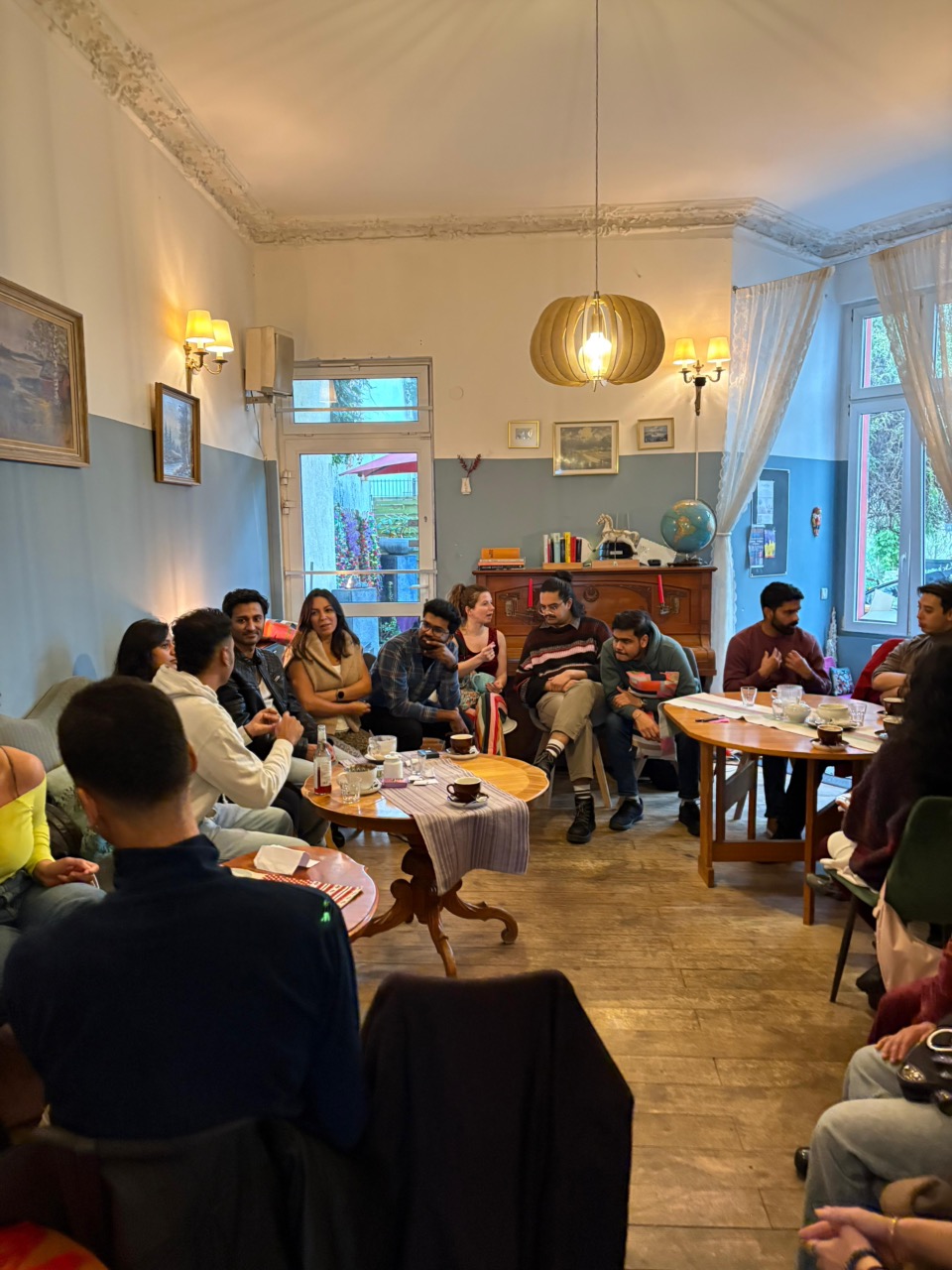 Members chatting over drinks at a cafe
