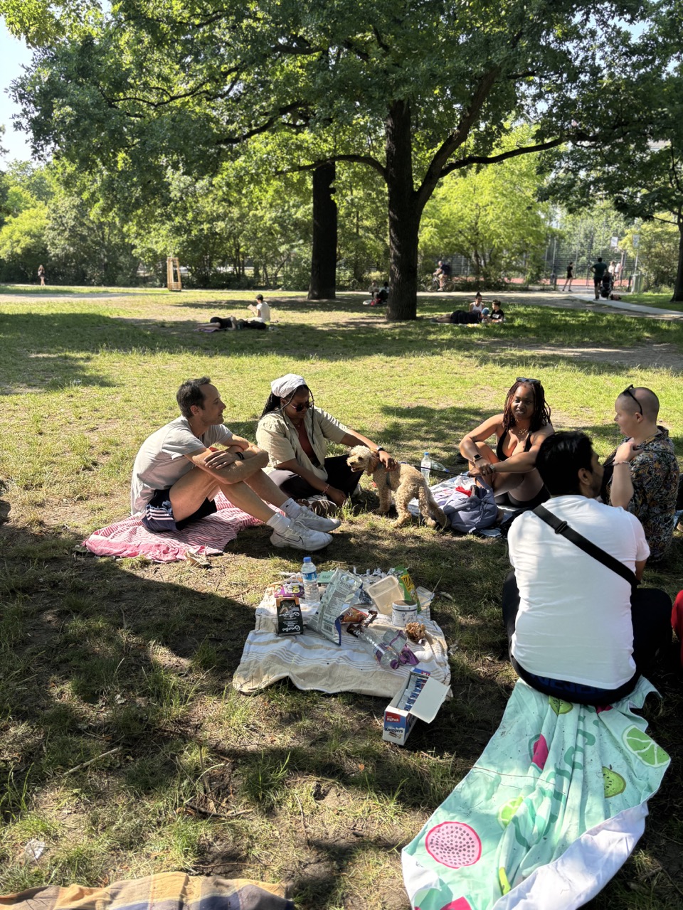 Community members sitting in a circle at Friedrichshain